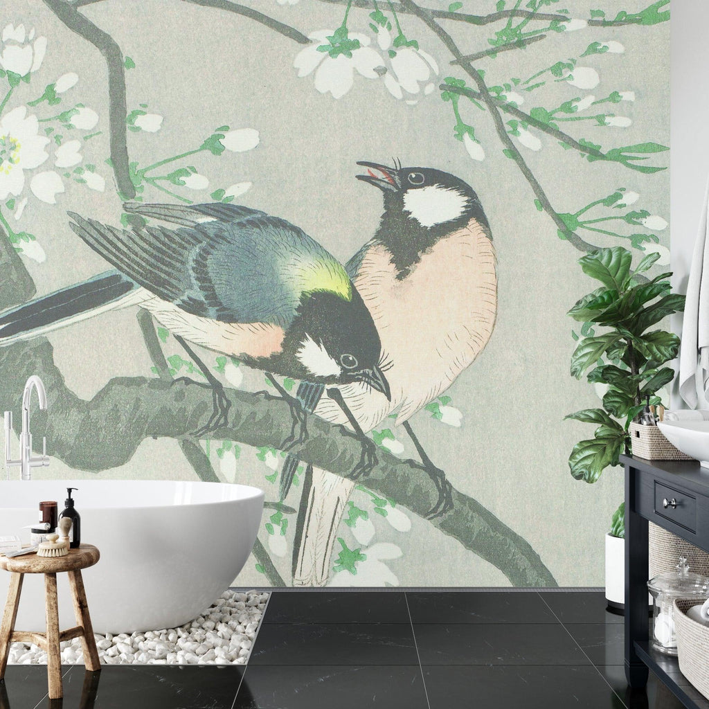 Oriental bird wallpaper adding zen feel to reading nook with cherry blossom details
