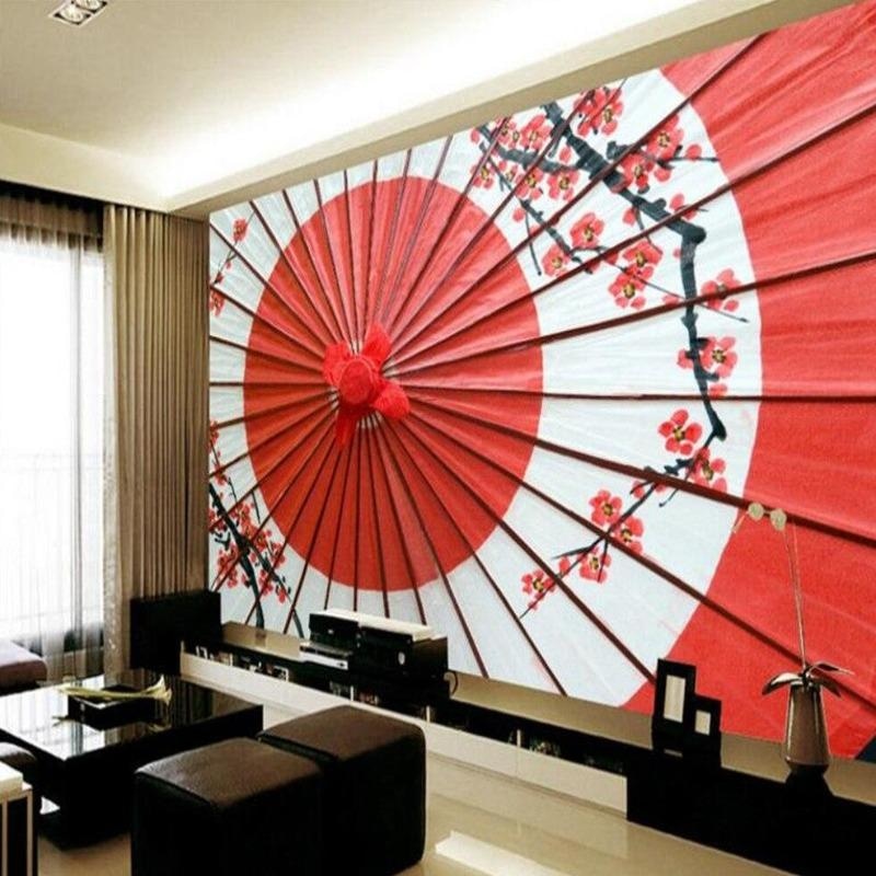 Japanese fan wallpaper with cherry blossoms creating a zen atmosphere in a modern living room with minimal furniture