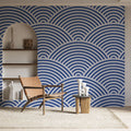 Japanese wave pattern wallpaper creating a calming atmosphere in a modern living room with white furniture and natural light