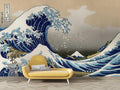Japanese Wave Mural Wallpaper creating dramatic impact in modern living room, deep blues against light walls