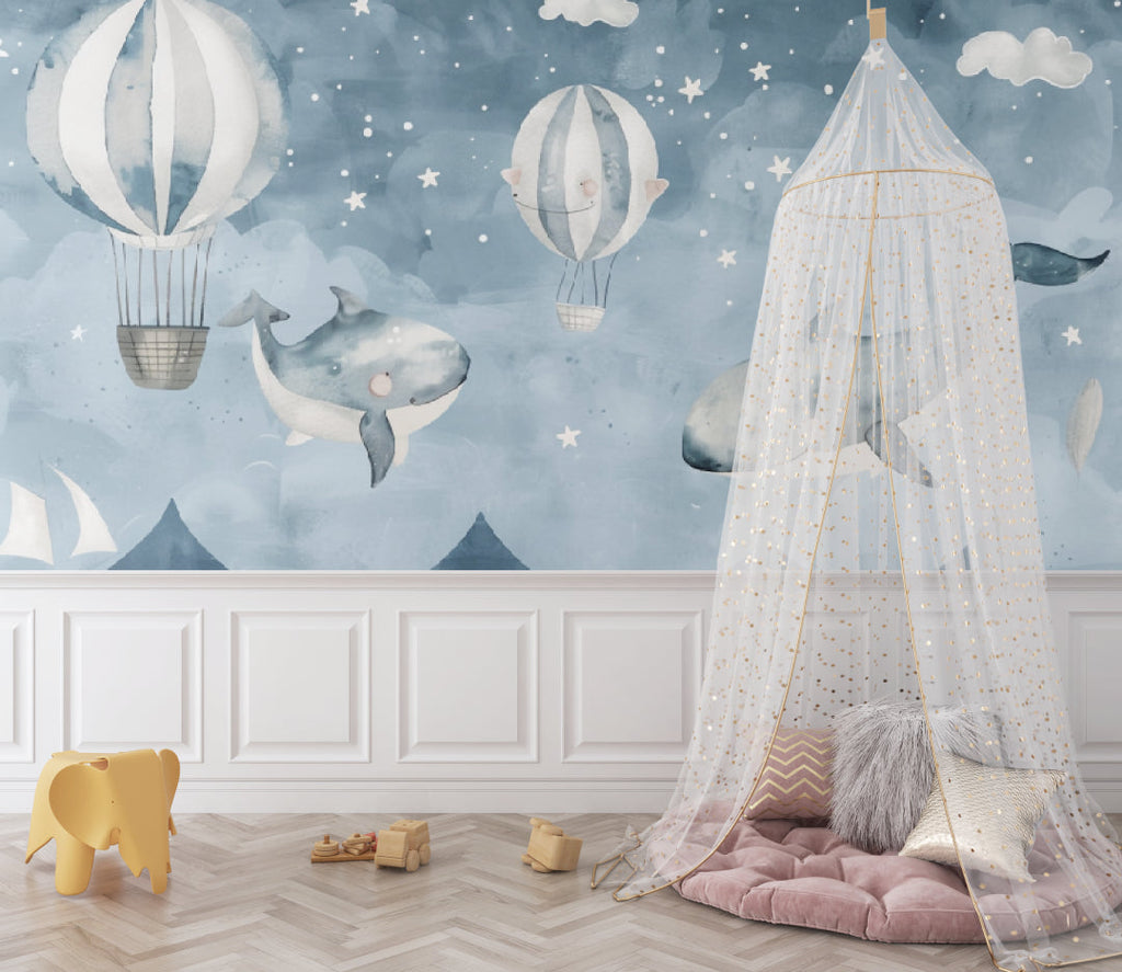 Kids bedroom featuring whale and hot air balloon mural with reading nook