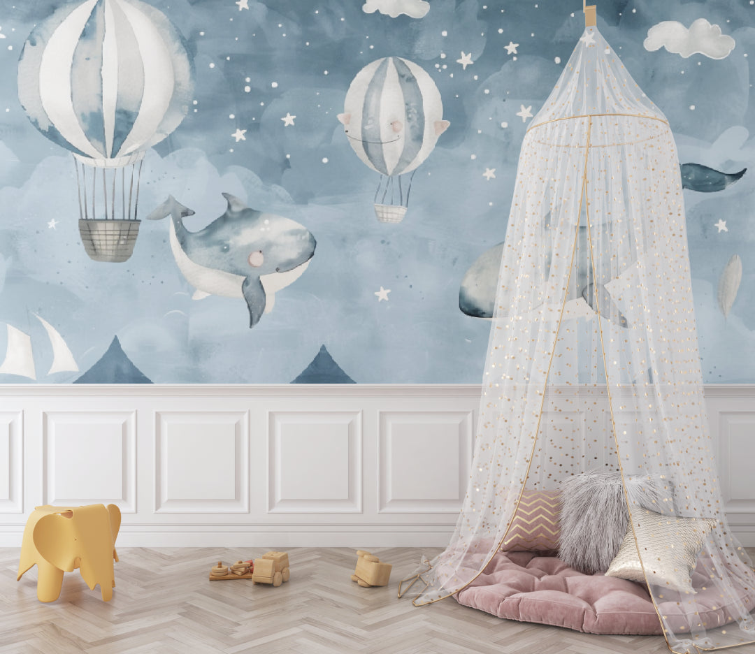 Kids bedroom featuring whale and hot air balloon mural with reading nook