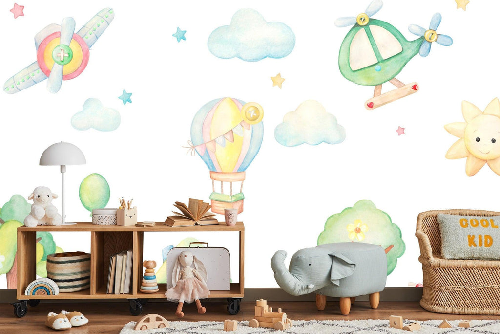 Hot air balloon nursery wallpaper shown in bright kids bedroom with white furniture and playful accents