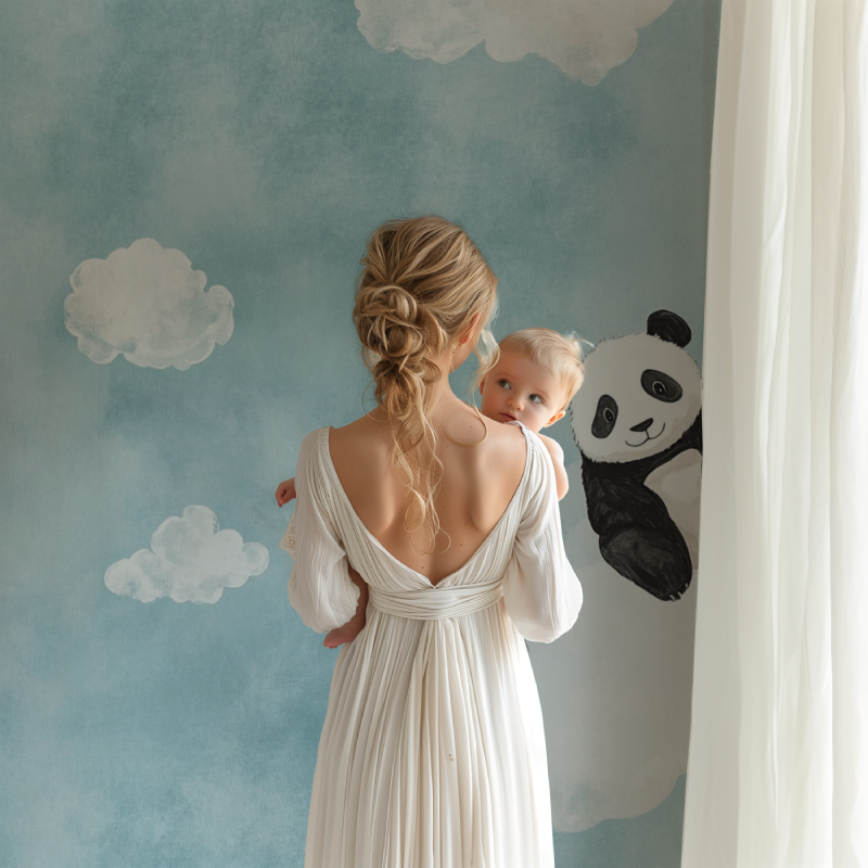 Panda nursery wallpaper creating a peaceful atmosphere in a modern white nursery with wooden furniture