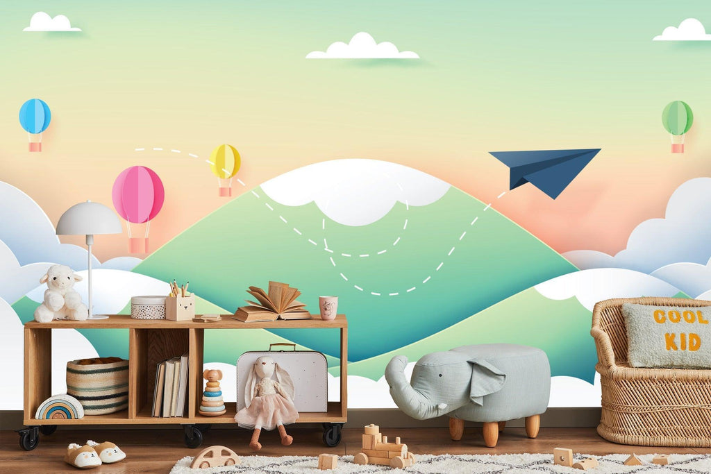 Paper airplane and hot air balloon wallpaper creating magic in a modern nursery with white furniture
