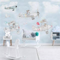 Flying animals wallpaper creating a magical atmosphere in a bright nursery with white furniture and natural light