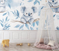 Koala nursery wallpaper bringing calm to a modern nursery with rocking chair and natural decor
