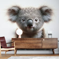 Koala wall mural creating a peaceful atmosphere in a modern nursery with white furniture and natural wood accents
