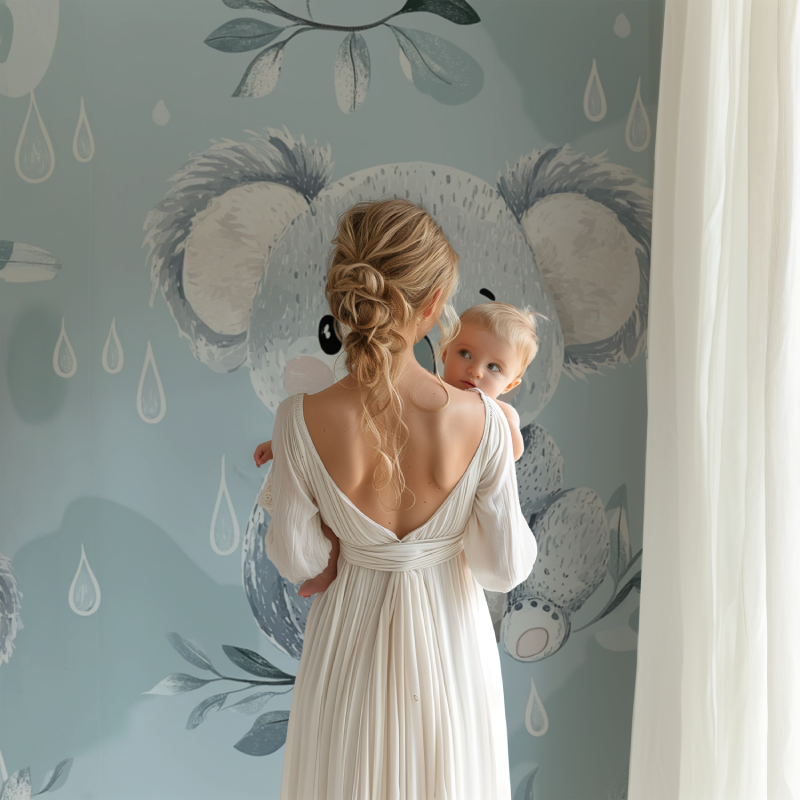 Nursery corner with koala rain drops wallpaper and natural wood elements