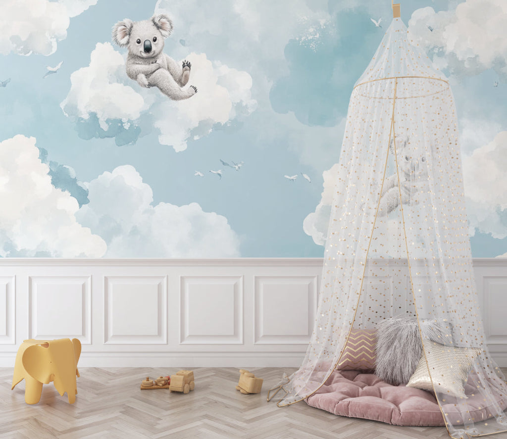Dreamy koala wallpaper installed in a baby's room with natural decor