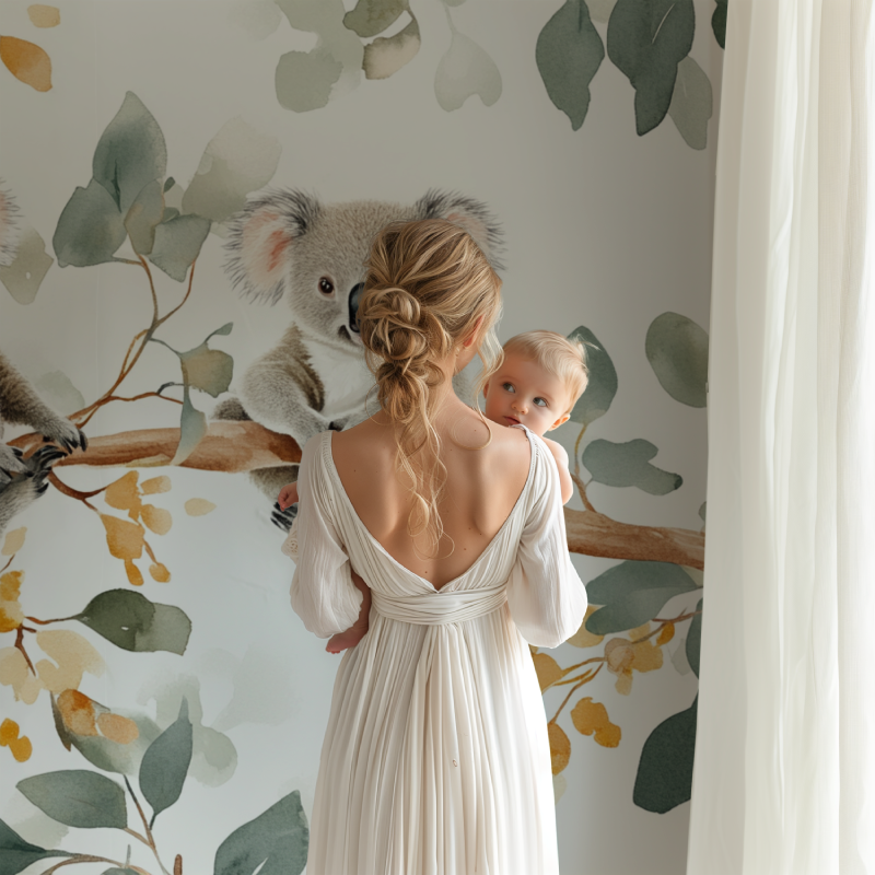 Koala and eucalyptus mural creating a calming atmosphere in a baby's room