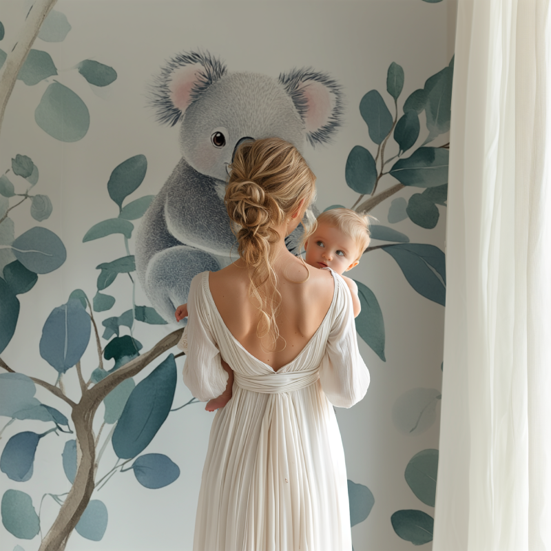 Koala wallpaper creating a peaceful atmosphere in a modern nursery with white furniture