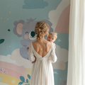 Koala nursery wallpaper with pastel rainbow design styled in a modern white nursery with natural wood furniture