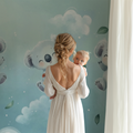 Koala nursery wallpaper creating a peaceful atmosphere in a modern baby room with white furniture