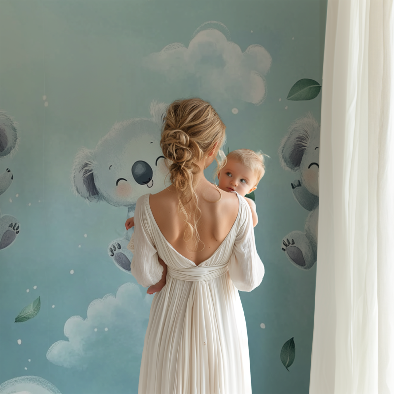 Koala nursery wallpaper creating a peaceful atmosphere in a modern baby room with white furniture