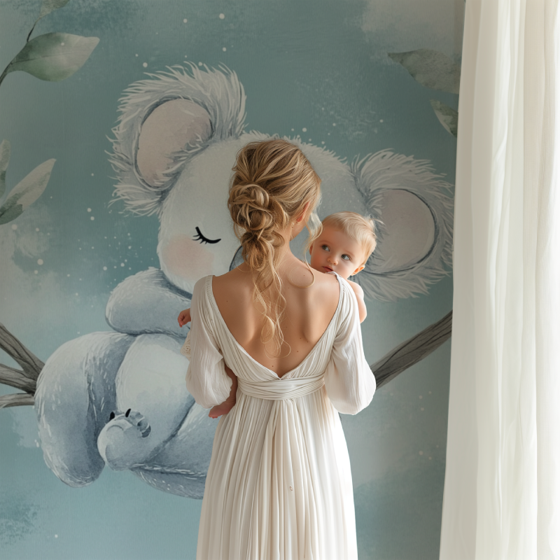 Koala wallpaper in a modern nursery with white furniture, creating a peaceful sleep environment