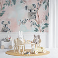 Koala nursery wallpaper in a bright modern nursery with white furniture and natural decor
