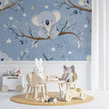 Koala nursery wallpaper creating a cozy atmosphere in a modern baby room with white furniture