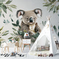 Koala wallpaper mural creating a peaceful atmosphere in a modern nursery with white furniture