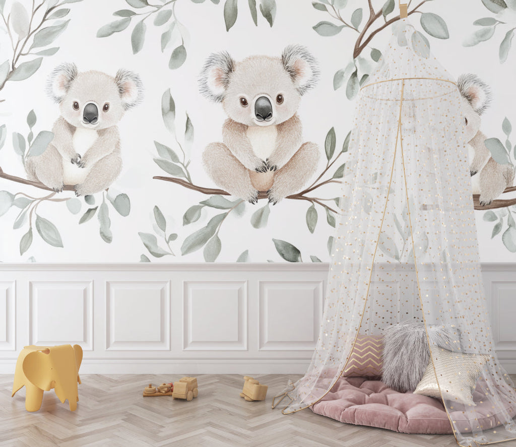 Watercolor koala wallpaper adding charm to a playroom with white furniture