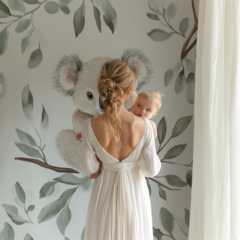Nursery koala mural styled with natural wood elements and soft textiles