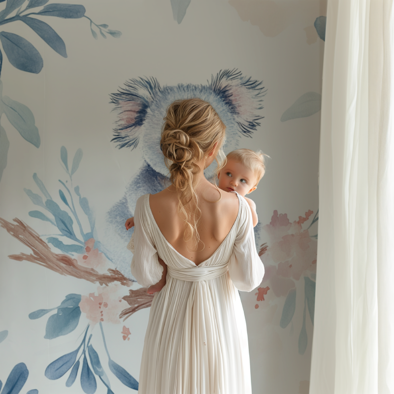 Koala wallpaper mural creating a peaceful atmosphere in a modern nursery with white furniture
