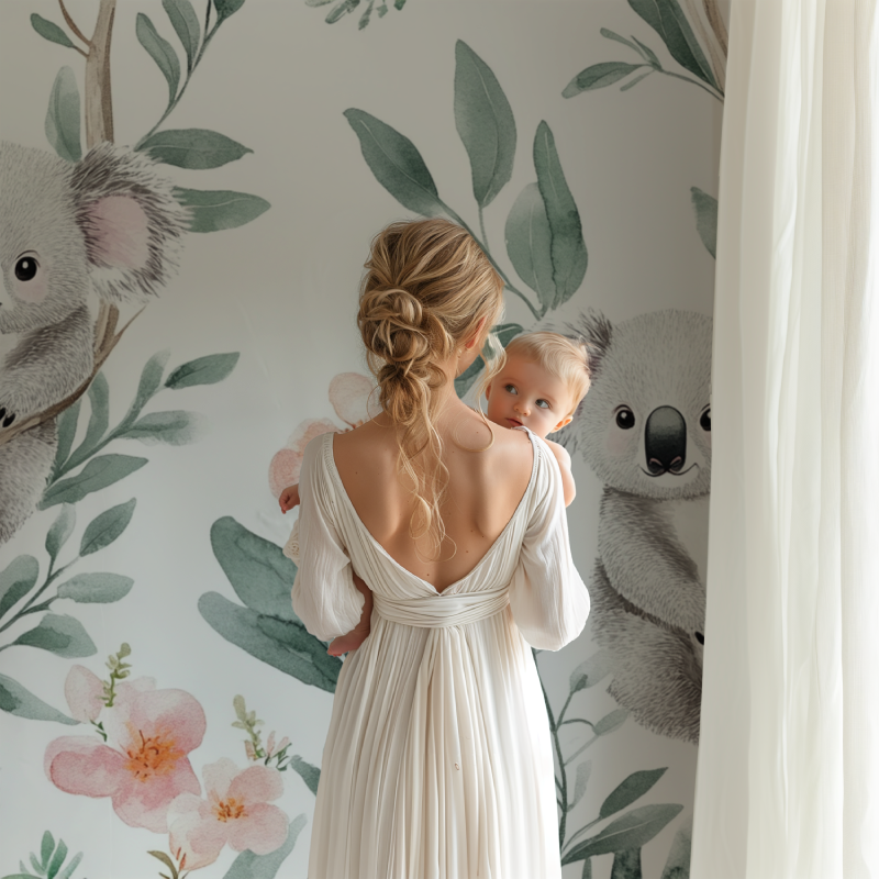 Koala wallpaper creating a peaceful atmosphere in a modern nursery with white furniture and natural light