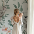 Koala wallpaper creating a peaceful atmosphere in a modern nursery with white furniture and natural light