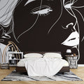 Line art portrait wallpaper creating dramatic impact in modern living room with minimalist furniture