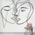 Line art face wallpaper creating a modern statement wall in a minimalist living room with natural lighting