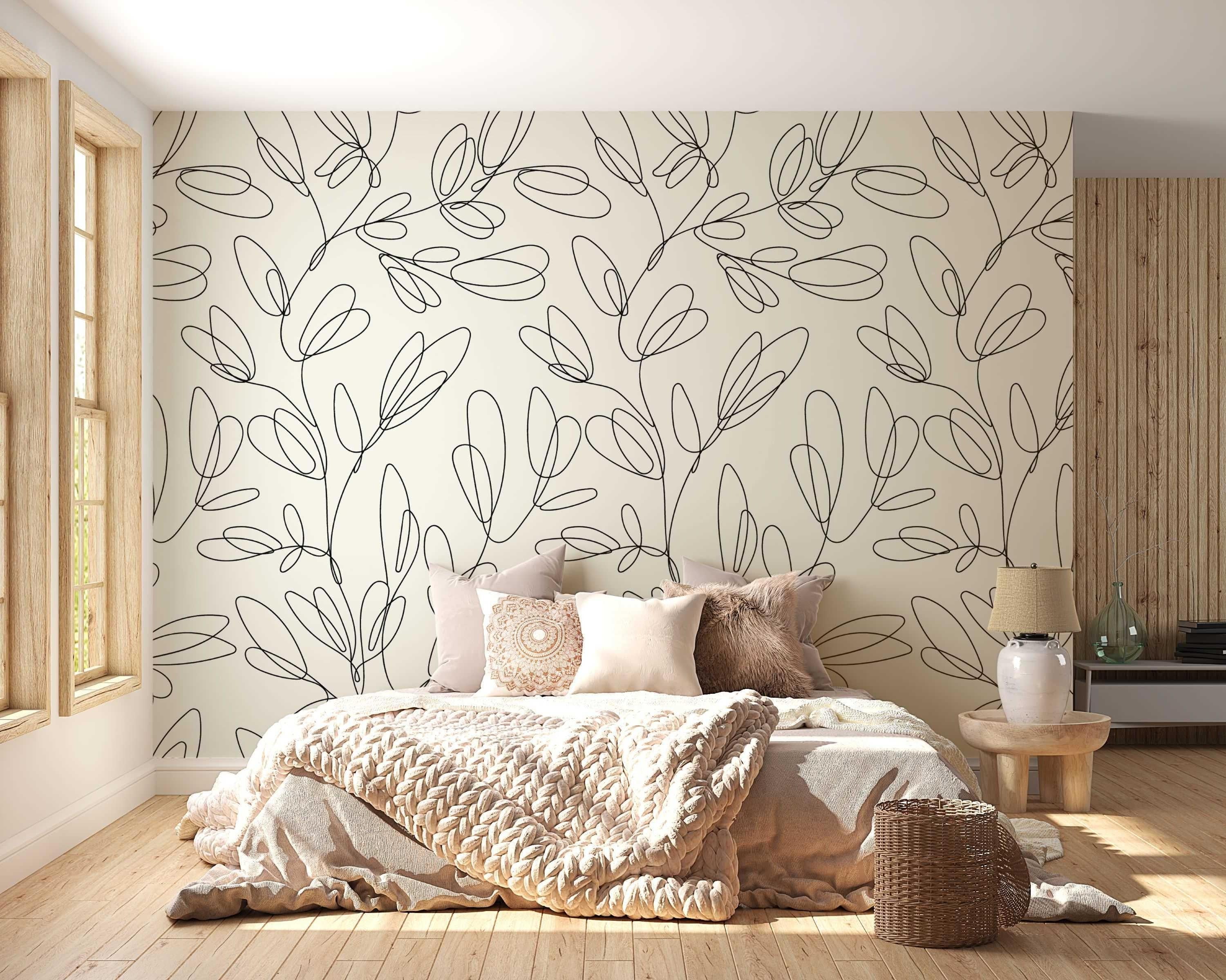 Modern line art floral wallpaper creating a serene atmosphere in a bright Scandinavian living room setting