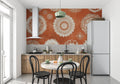 Mandala wallpaper in modern living room showing terracotta and white geometric pattern
