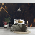 Black and gold marble wallpaper creating dramatic impact in modern living room with high ceilings and pendant lighting