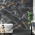 Black and gold marble wallpaper creating drama in a modern dining room with pendant lights