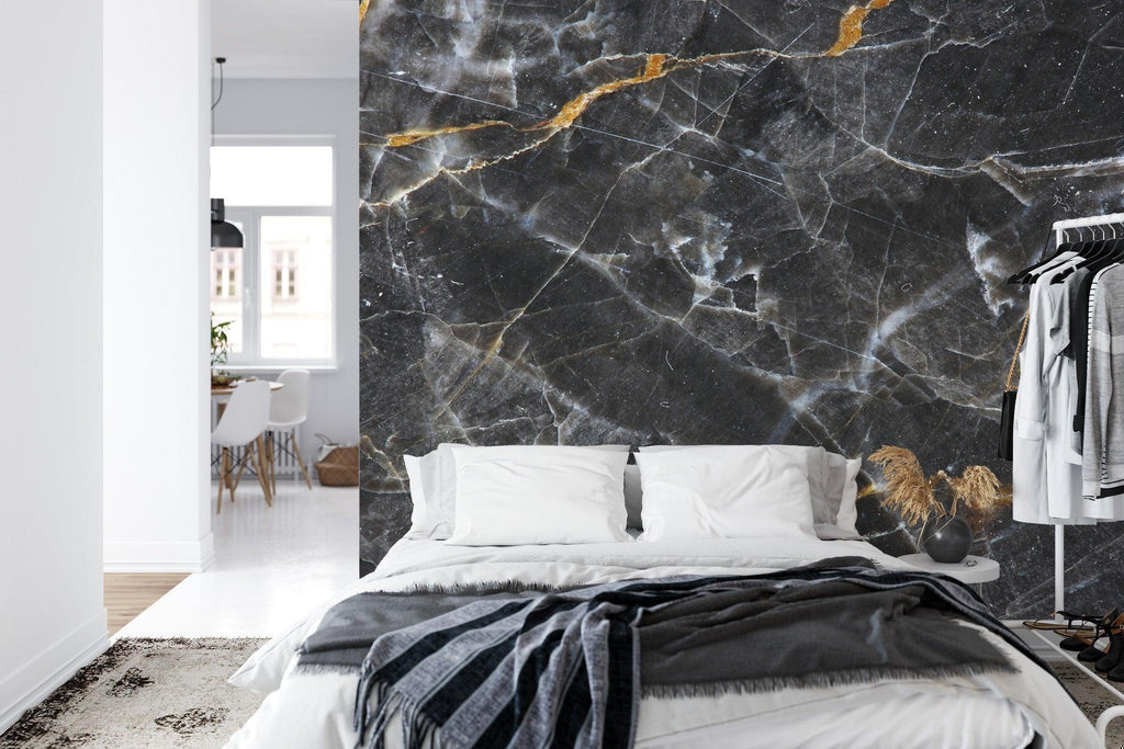 Luxury marble wall mural transforming a master bathroom with gold fixtures