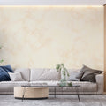 Beige and gold marble wallpaper in modern living room creating an elegant backdrop for grey sofa
