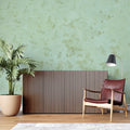 Sage green marble wallpaper in modern living room showing natural stone texture and soft lighting