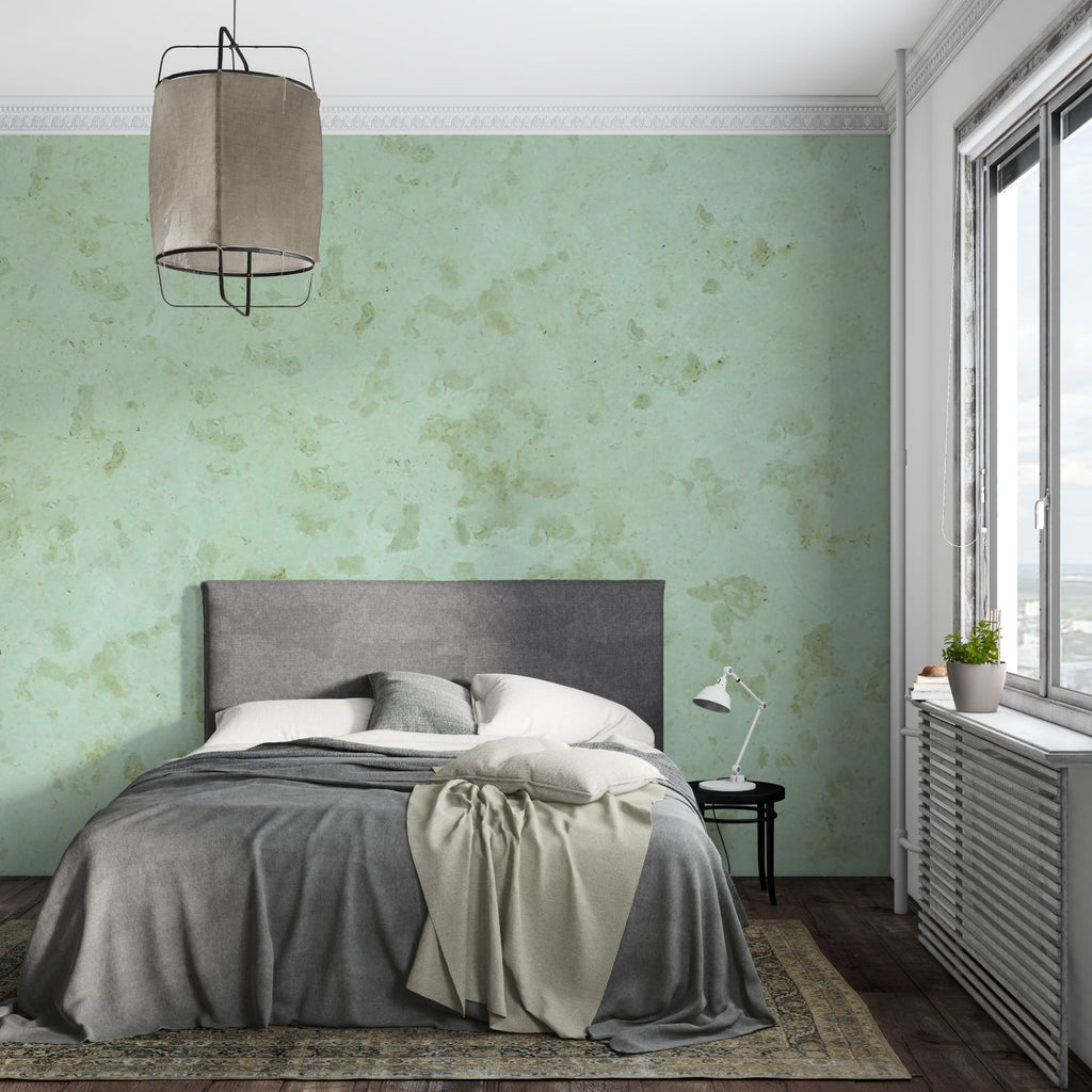Bathroom decorated with sage green marble effect wallpaper in natural light
