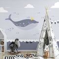 Marine animals wallpaper creating a dreamy atmosphere in a modern nursery with white furniture
