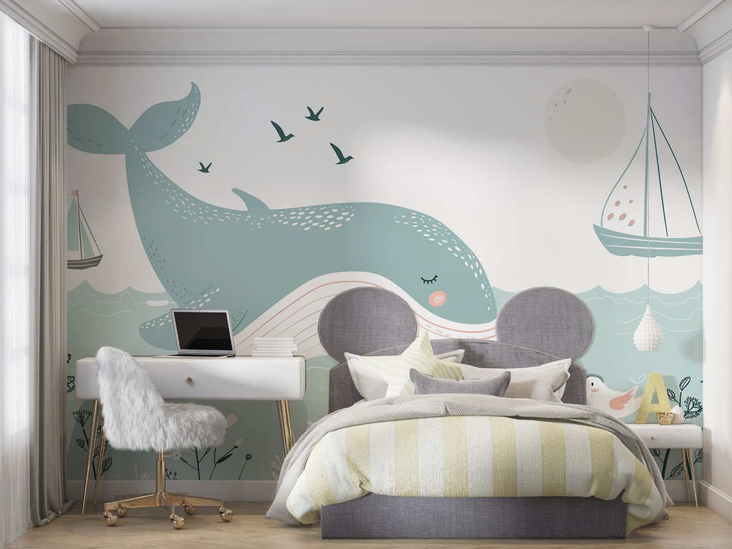 Whale wall mural displayed in a coastal-themed children's bedroom with blue accents