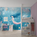 Mermaid Princess wallpaper in a dreamy nursery with soft pink accents and ocean-themed decor