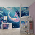 Mermaid wallpaper creating magic in a girl's bedroom with soft lighting and floating bubbles