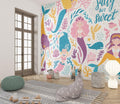 Mermaid wall mural bringing magic to a cozy children's bedroom with soft lighting