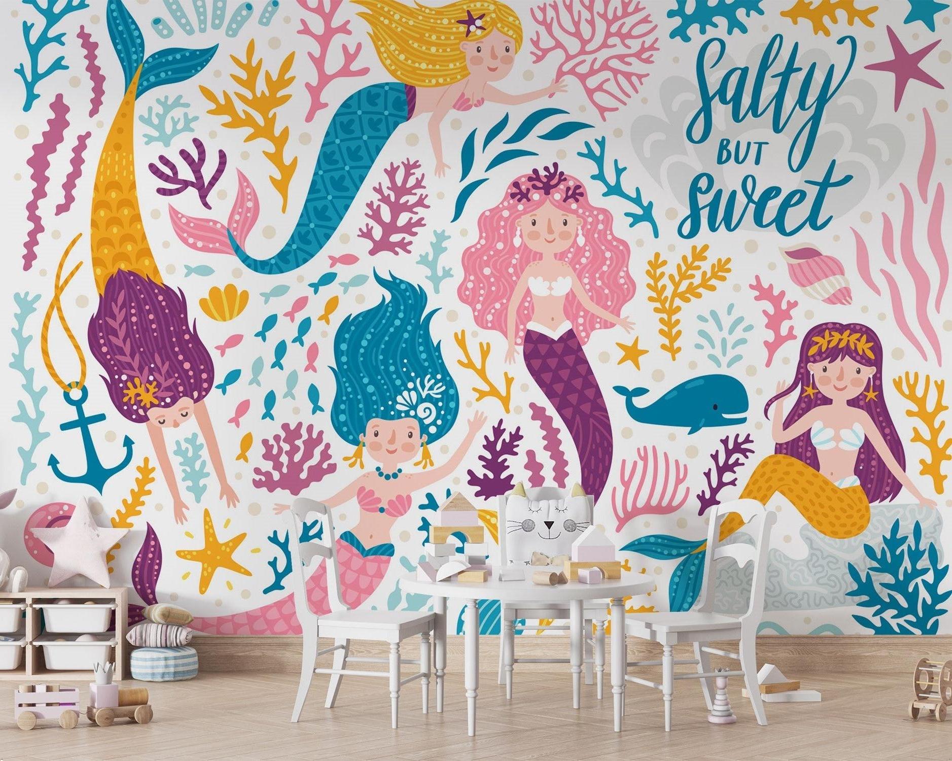 Ocean themed wallpaper transforming a modern playroom into an underwater paradise