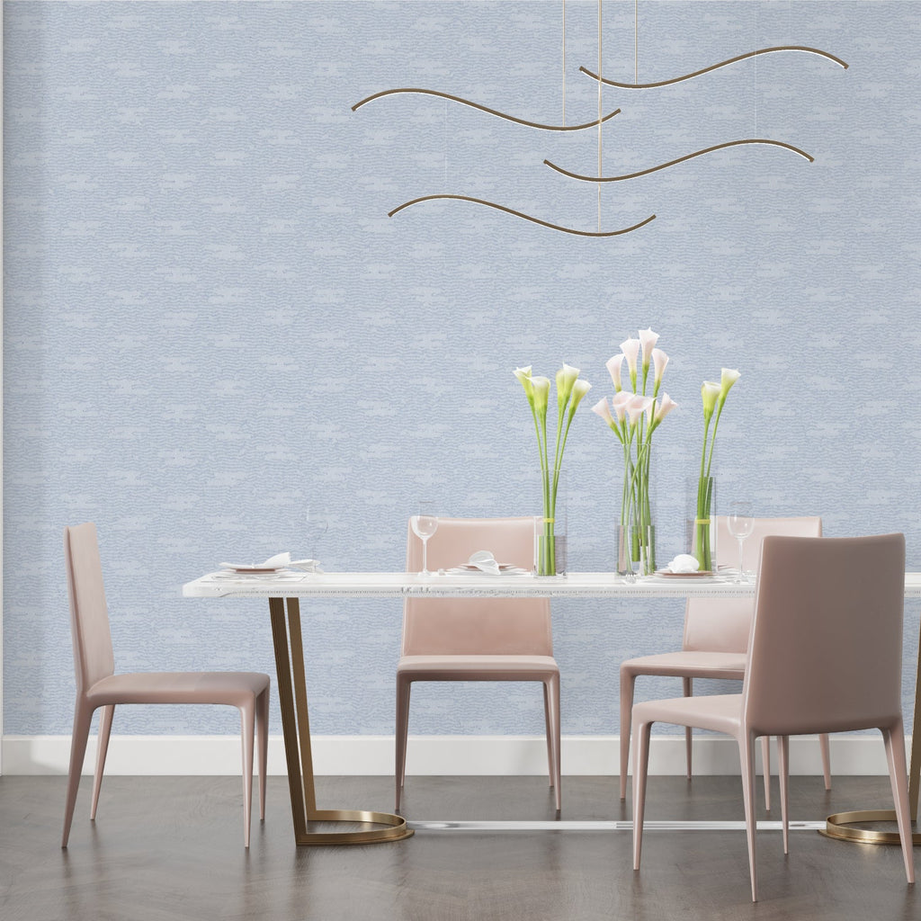 Minimalist blue wall mural in contemporary bedroom creating serene atmosphere