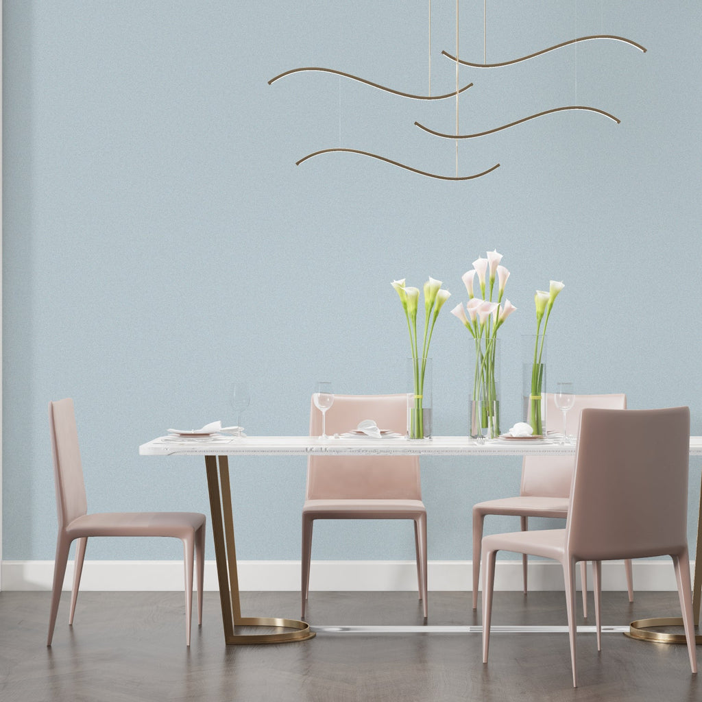 Home study decorated with light blue solid wallpaper showing clean minimal design