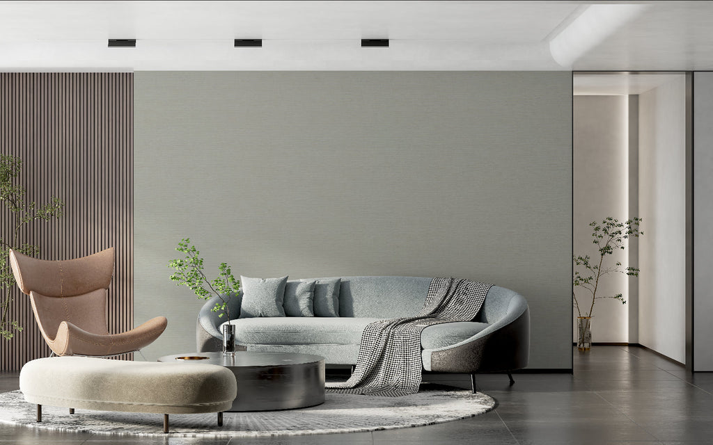 Sage green minimalist wallpaper showcased in a dining room with modern decor