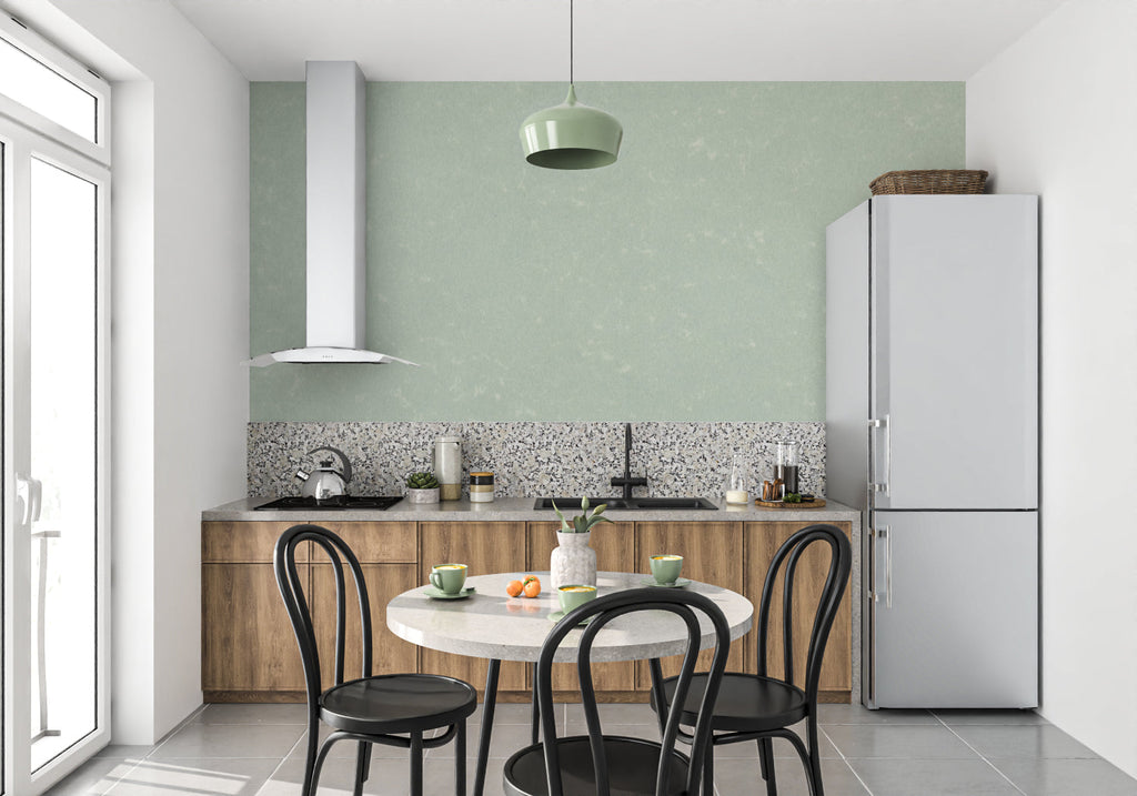 Soft mint wall mural in a cozy bedroom showing the subtle texture catching morning light