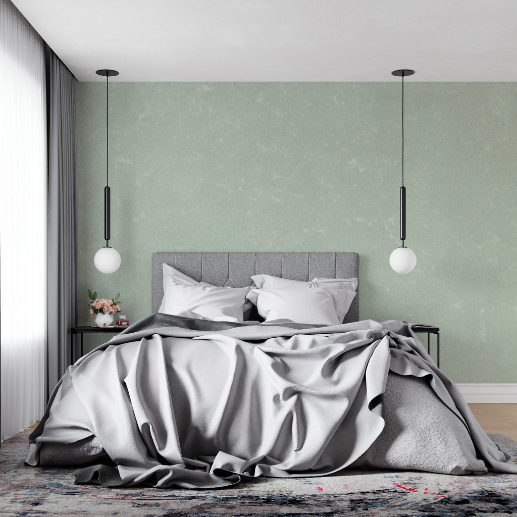 Modern home office with mint green textured wallpaper creating a calm work environment