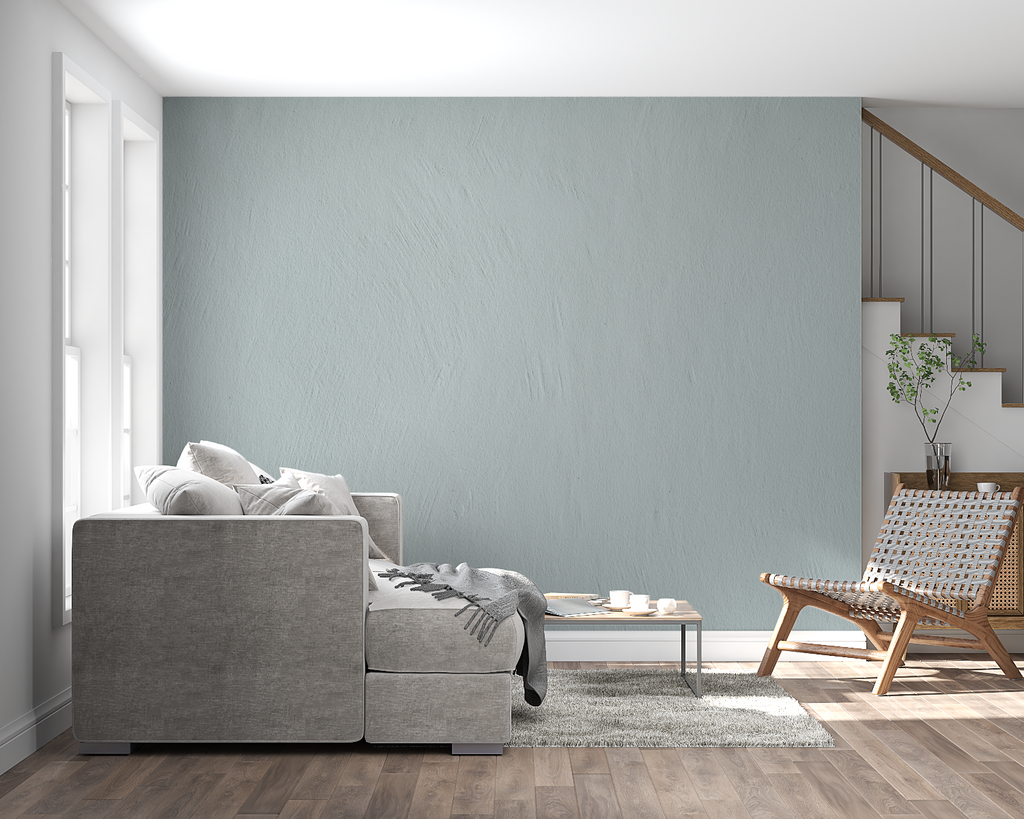 Kitchen accent wall with sage green textured mural complementing white cabinets